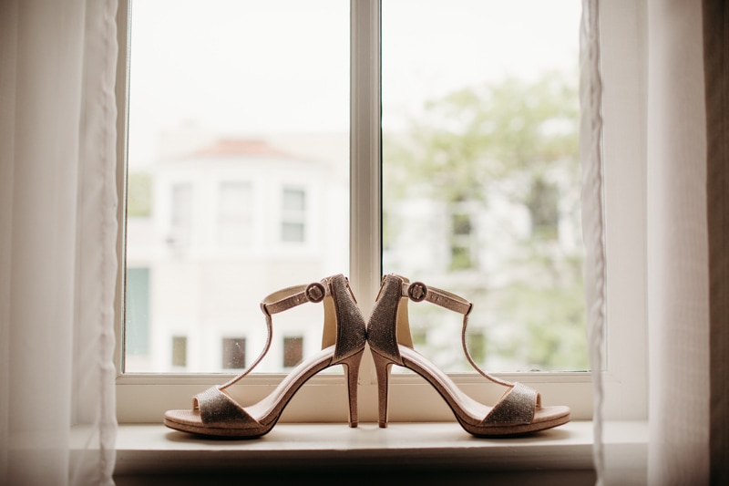 Wedding Photographer, shoes for the wedding day sit on a window sill