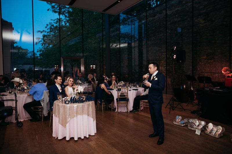 Wedding Photographer, the best man gives a speech at the wedding reception