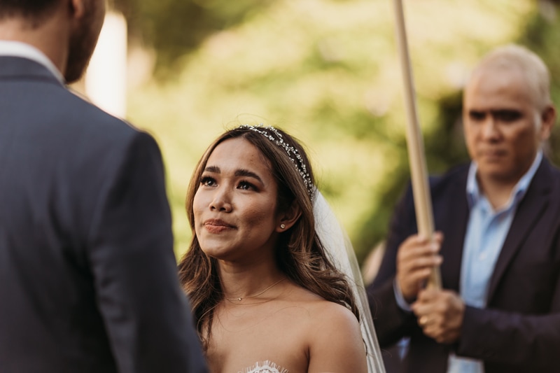 Wedding Photographer, a bride admires her husband during wedding vows
