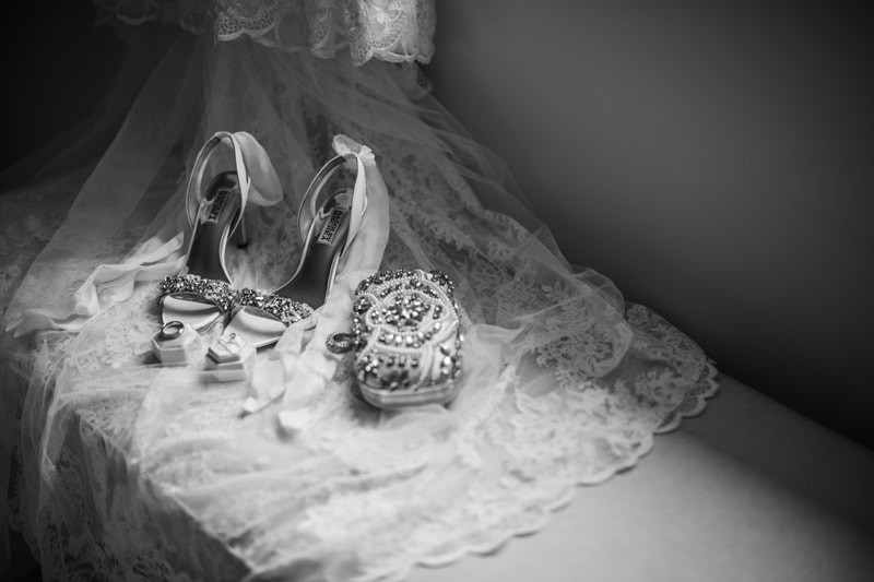 Wedding Photographer, wedding, shows, rings, and purse are displayed beside each other