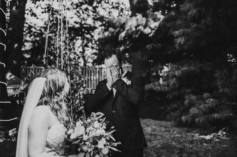 Wedding Photographer, the groom covers his eyes in the garden as his bride-to-be walks out