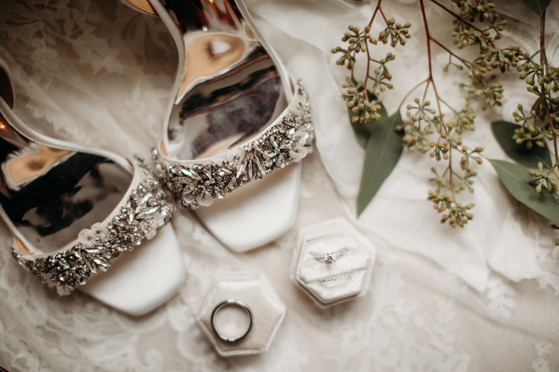 Wedding Photographer, sequined wedding shoes and rings sit beside each other
