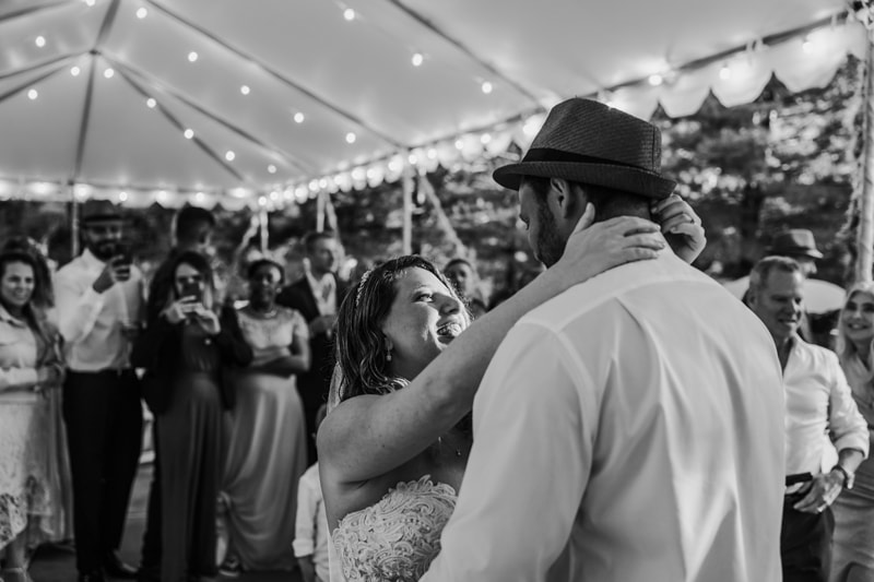 Wedding Photographer, the bride and groom gaze at each other as they dance