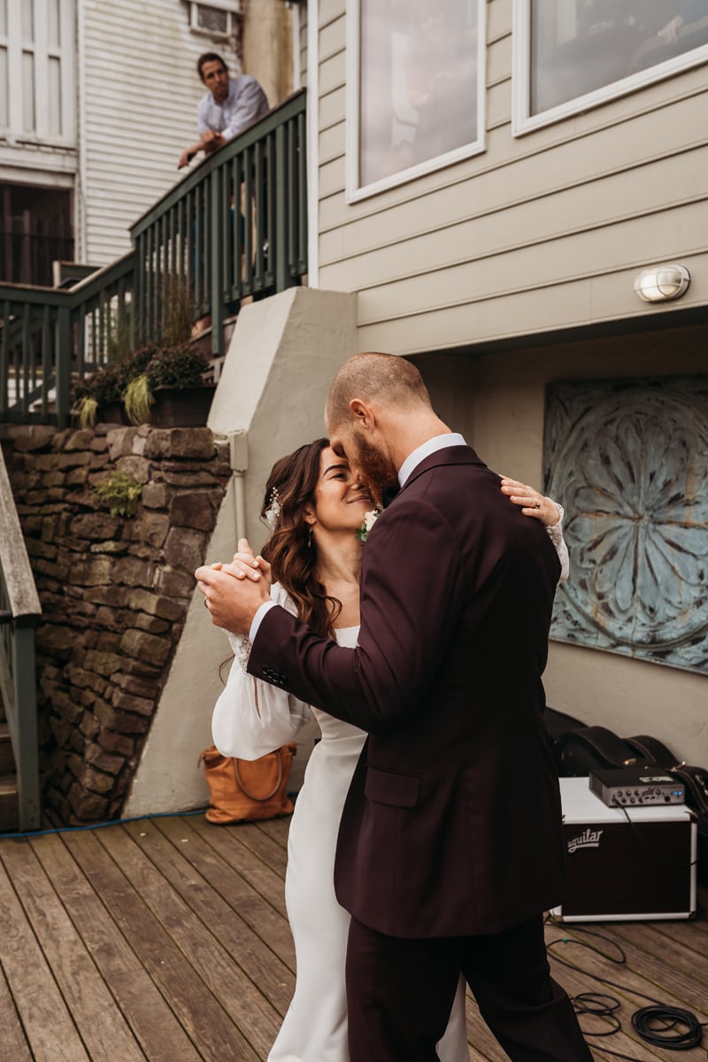 Wedding Photographer, bride and groom dance on the patio