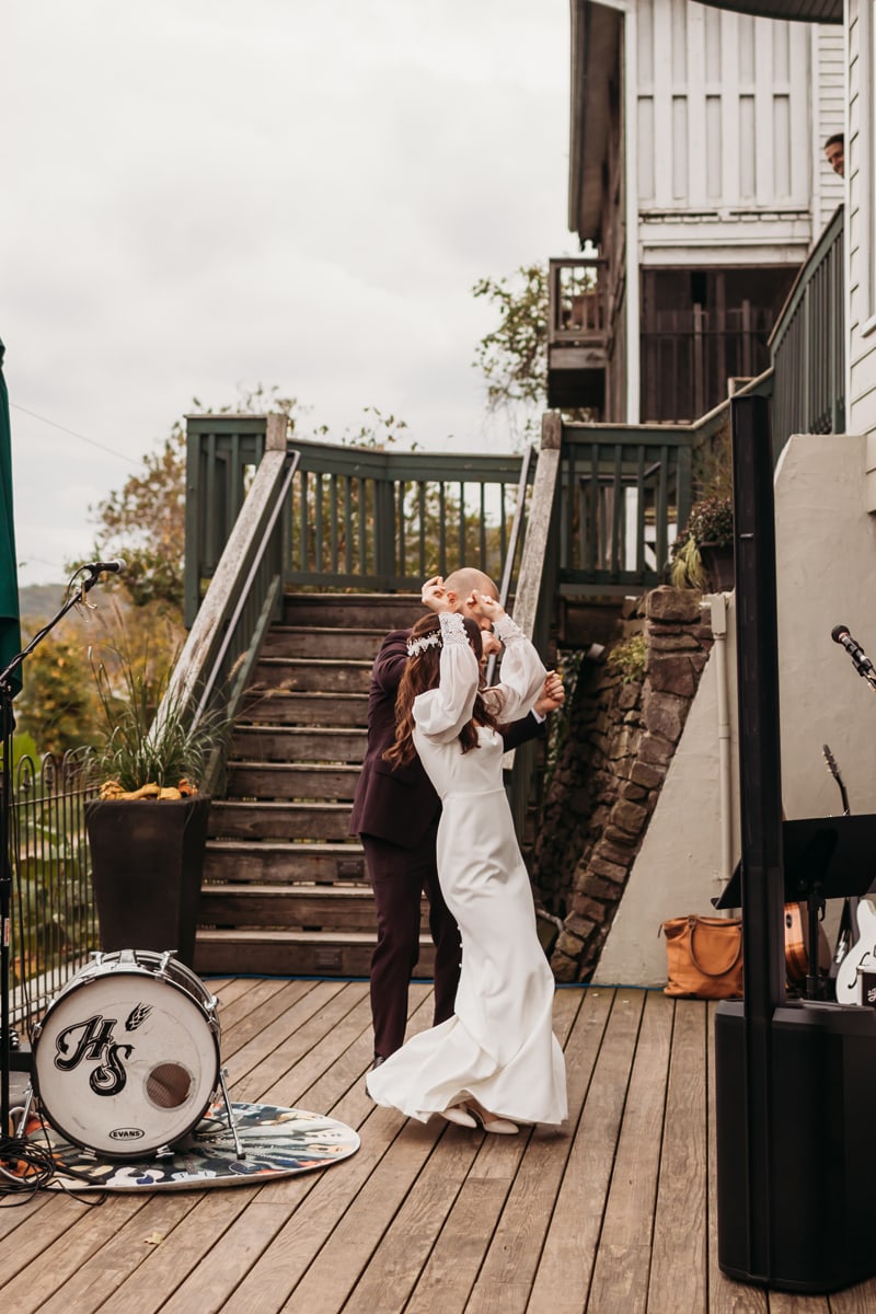 Wedding Photographer, bride and groom dance on a home patio