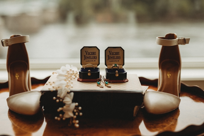 Wedding Photographer, two rings are displayed beside each other in boxes that read "Vecere Jewelers"